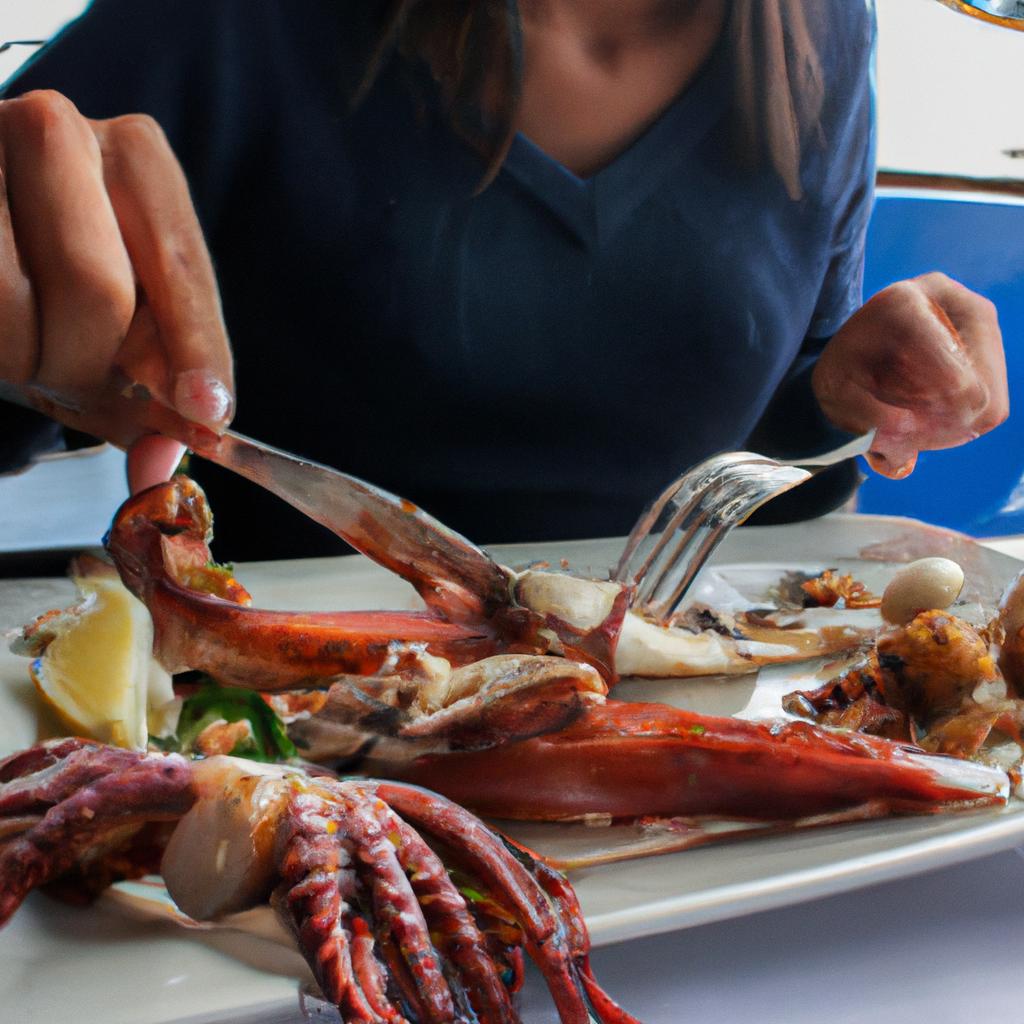 Person eating seafood at restaurant